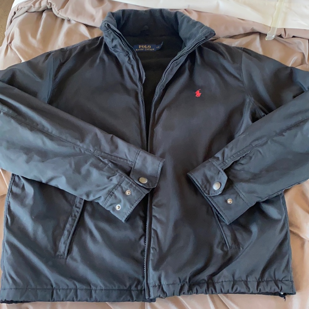 Polo jacket. Black on black. Waterproof, packable hood.